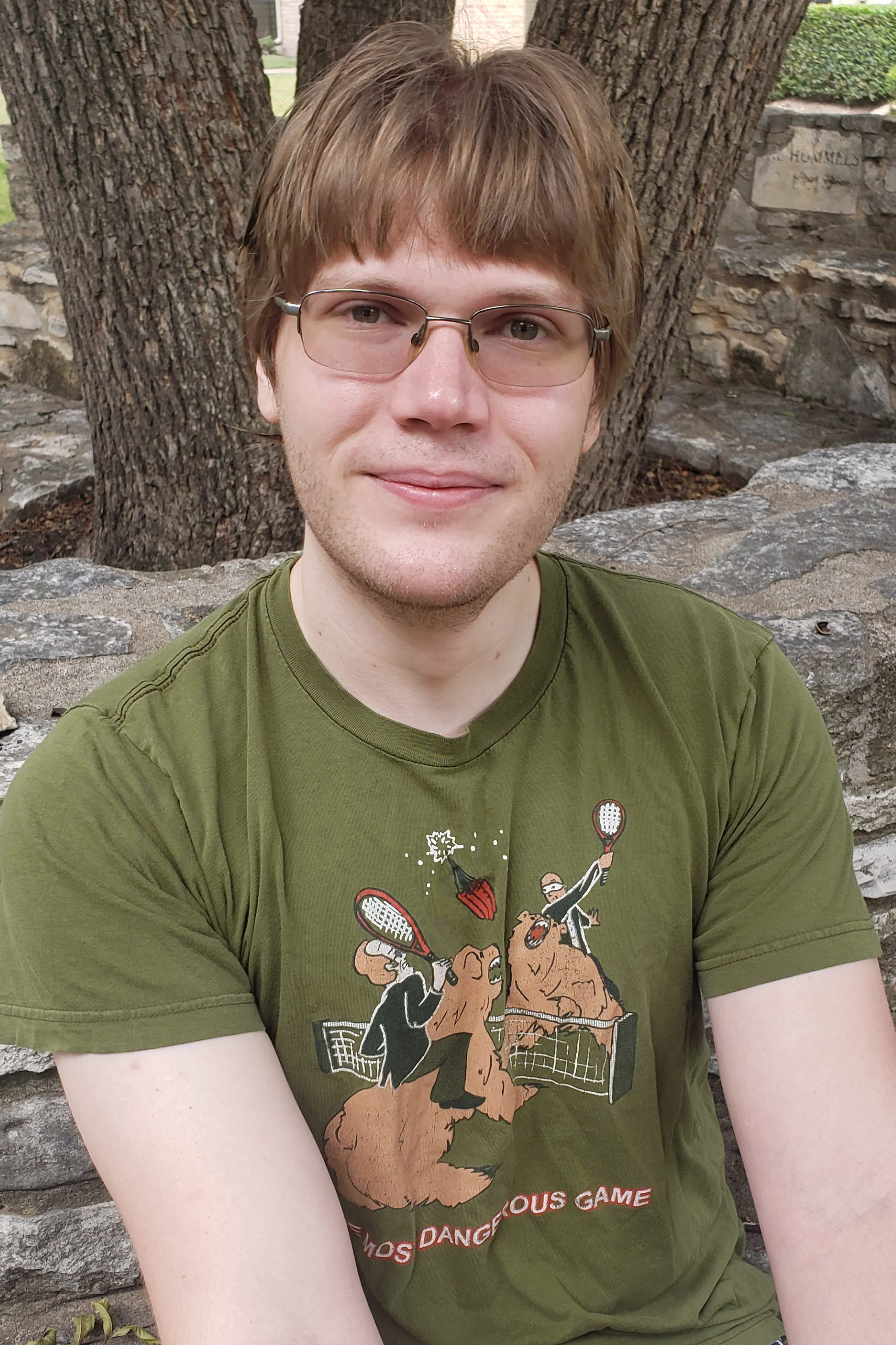 Picture of me sitting on a stone bench.