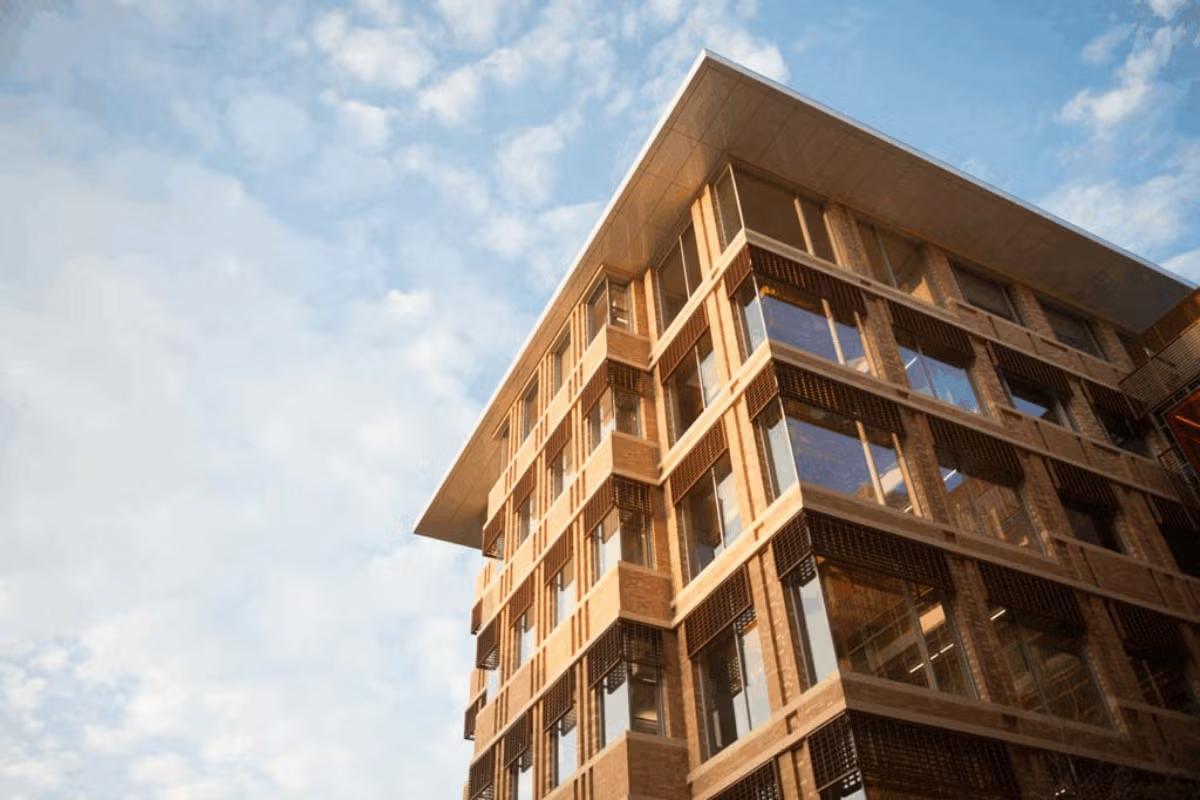 Photograph of one of the UT Austin Gates Dell Complex towers, shot from below looking upward.