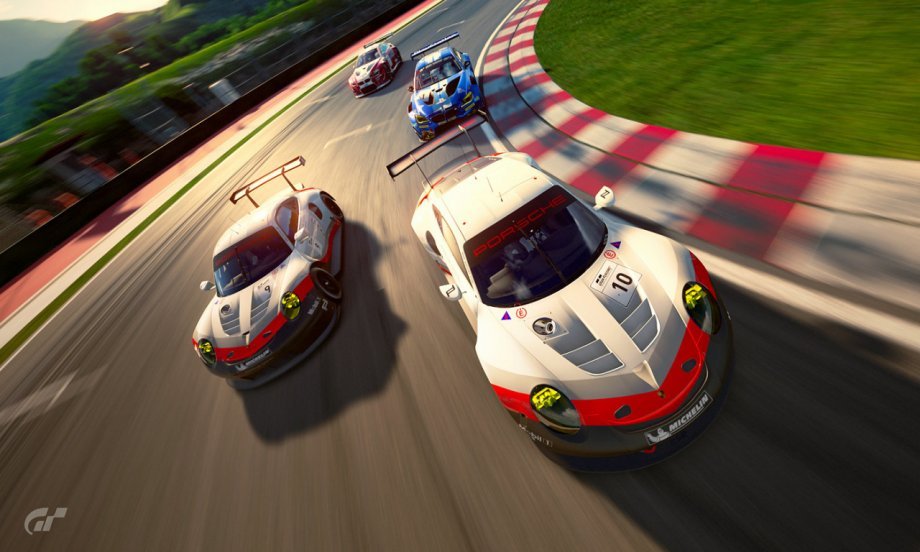 race cars rounding corner on race track