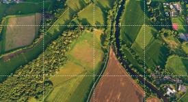 Aerial image showing different types of land use, including farming, forest and housing. Aerial image showing different types of land use, including farming, forest and housing.