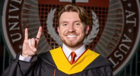 Carter posing in front of the UT seal