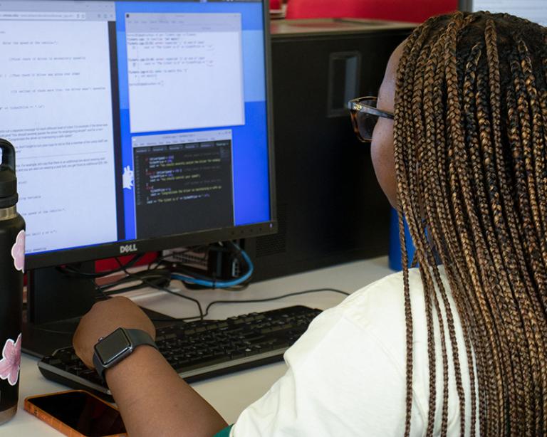 Academy for All student coding in the UT Computer Science computer lab