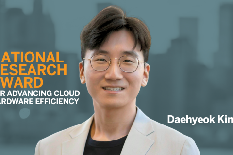 A professional portrait of Daehyeok Kim, smiling and wearing glasses and a light-colored blazer. Bold text on the left reads "National Research Award for Advancing Cloud Hardware Efficiency" against a blurred cityscape background. His name appears on the right side in white text.