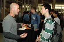 LogicMonitor representative talks with UTCS Student about company culture.