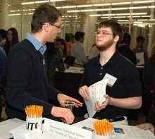 Chris Enders from UT Information Technology Services representative answers a UT