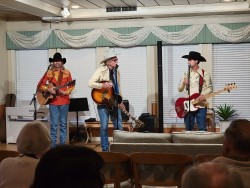 some of the evening entertainers playing guitar and singing