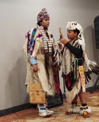 Nez Perce children dancing in traditional costumes